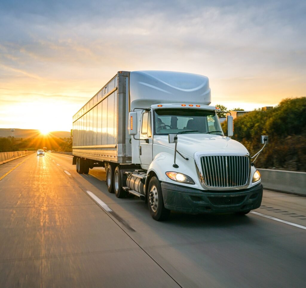 delivery truck move in on an interstate at dusk